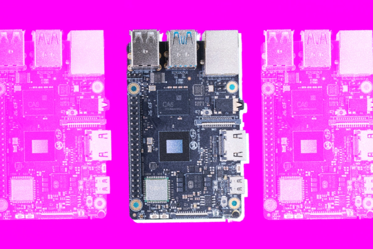 Single-board computer shown in full color between two magenta-tinted copies on a pink background